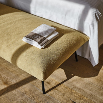 AREA pouf with four legs in painted metal